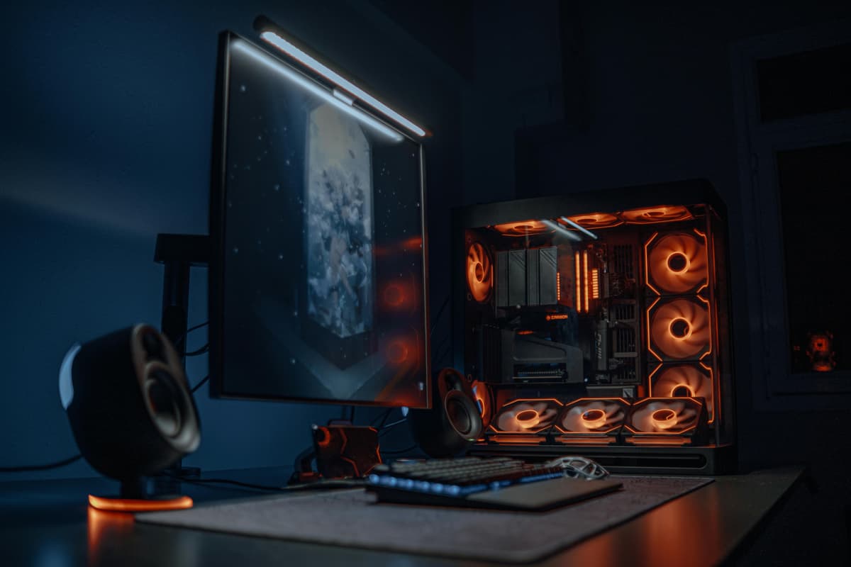 A monitor light bar illuminating a modern home office desk.