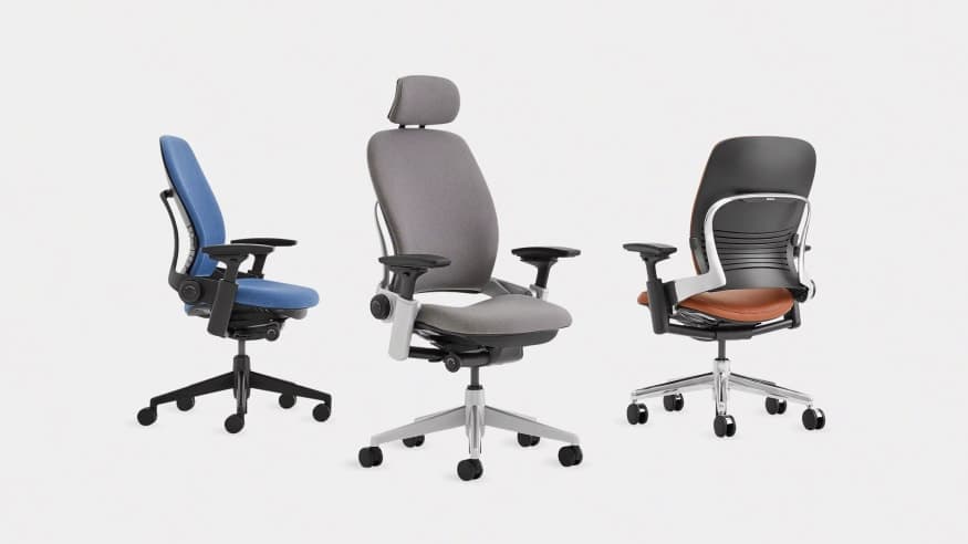 Three ergonomic office chairs photographed on a white background.