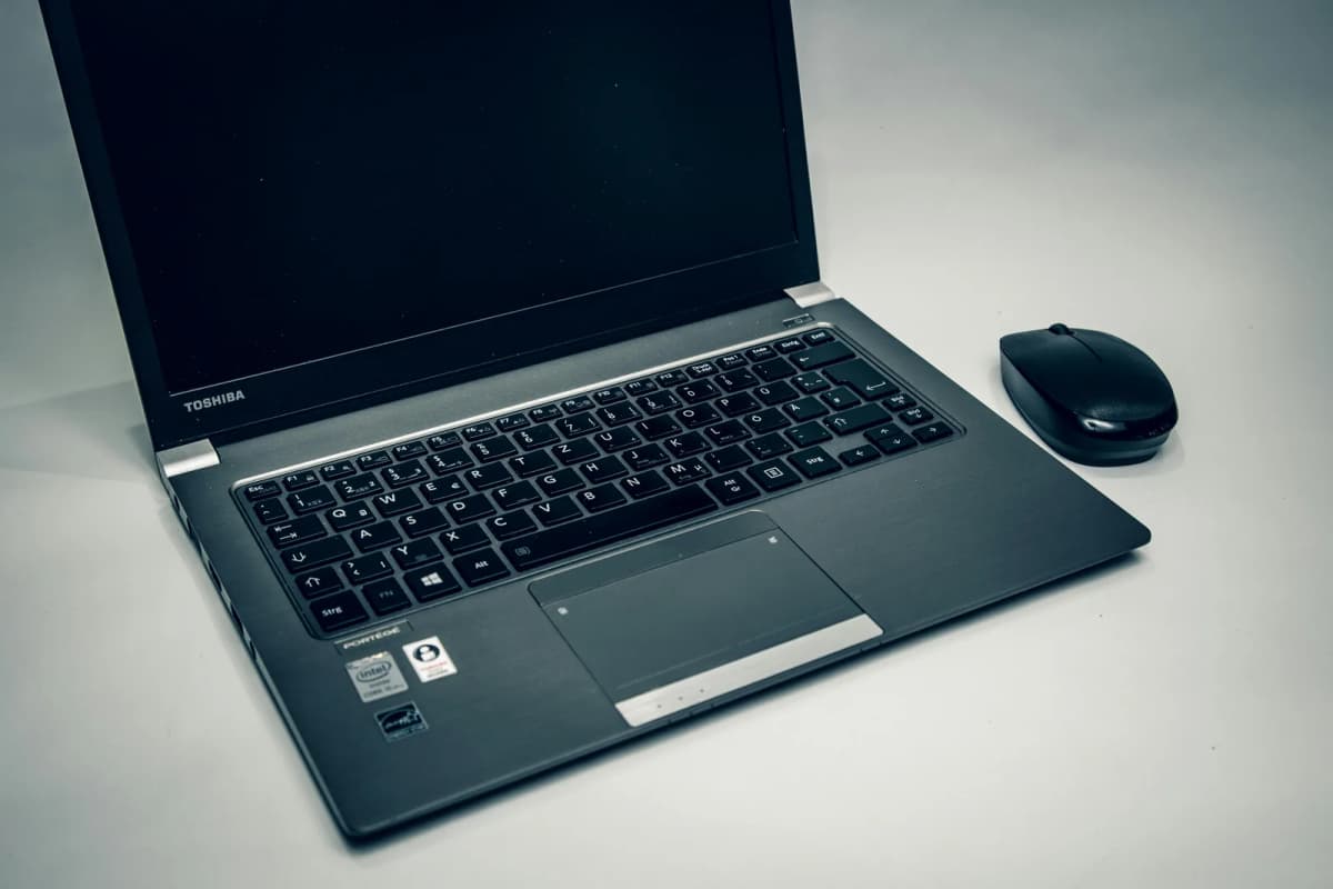 A close view of a laptop keyboard, representing real-world keyboard failure and replacement decisions.