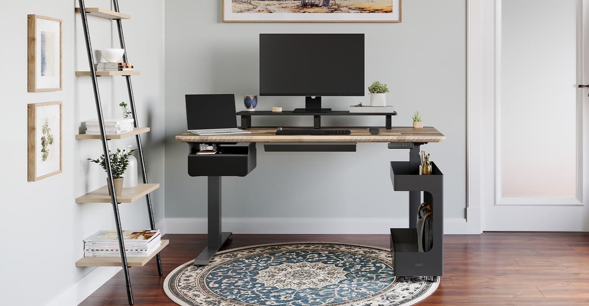 A desk setup using the Vari Desk Shelf to raise monitors and create storage underneath.