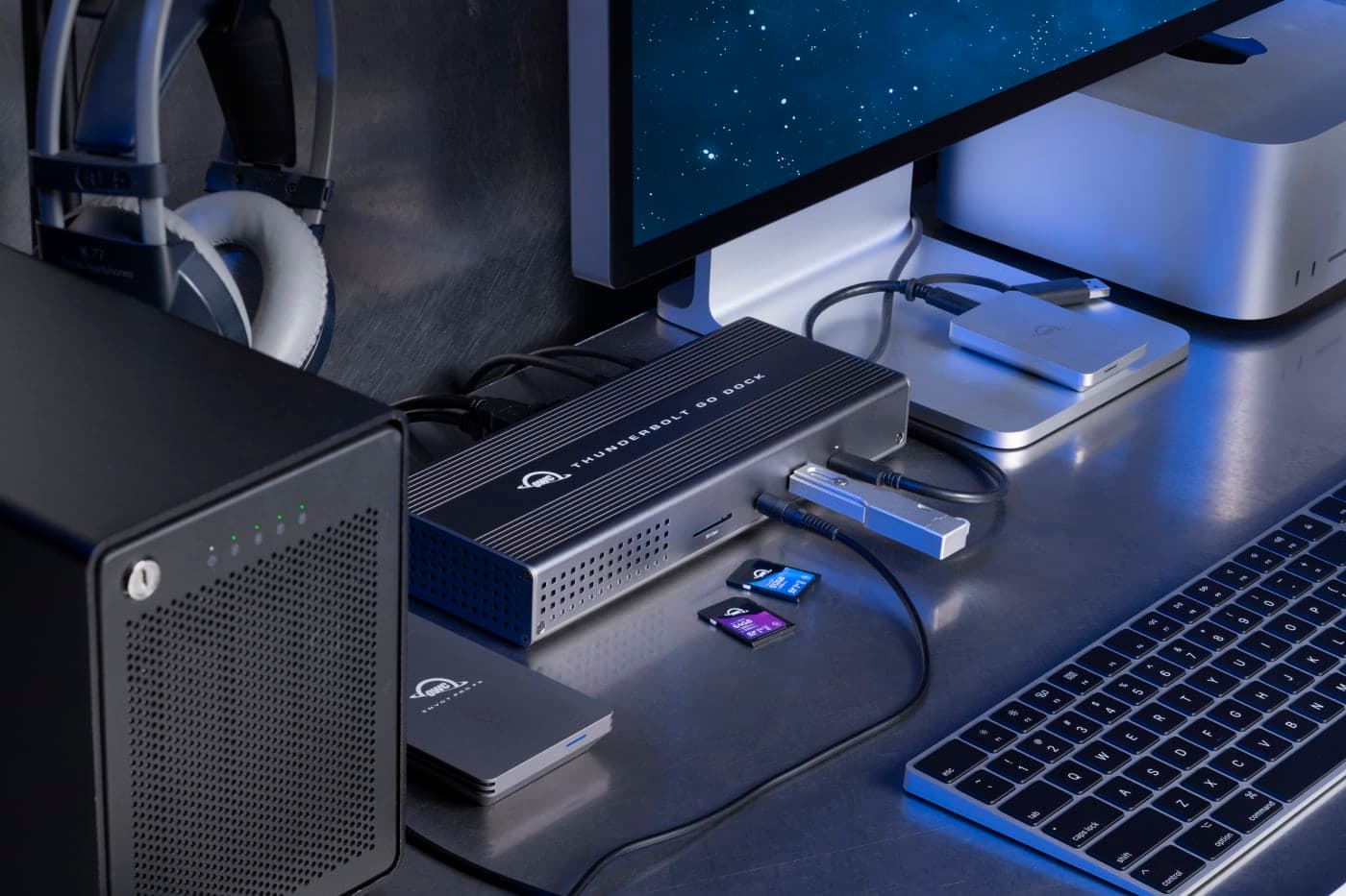 OWC Thunderbolt Go Dock connected in a desk setup beside a monitor.