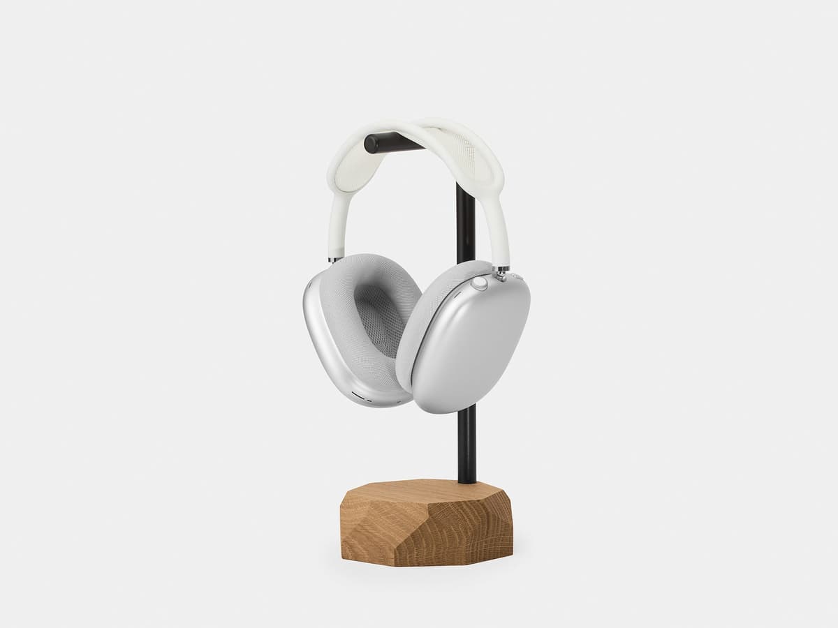 The Oakywood Headphones Stand holding a pair of over-ear headphones.