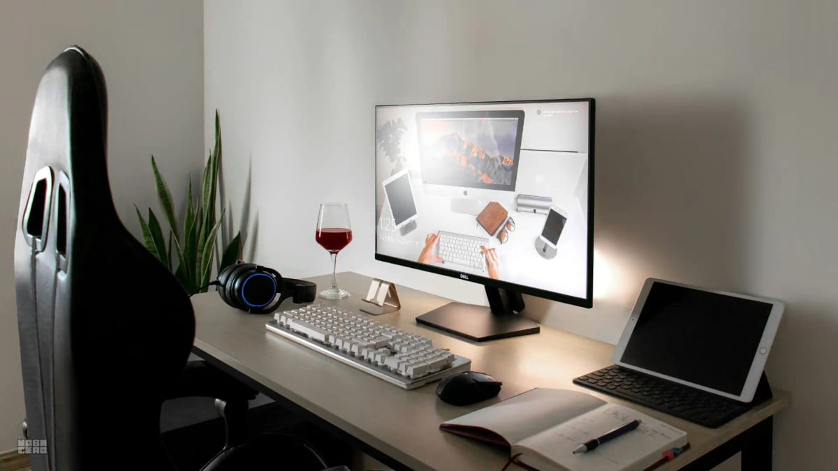 A side view of a desk showing the distance between a monitor and a user's seating position.