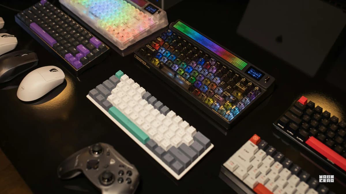 A close-up keyboard on a desk with soft natural light across the workspace.