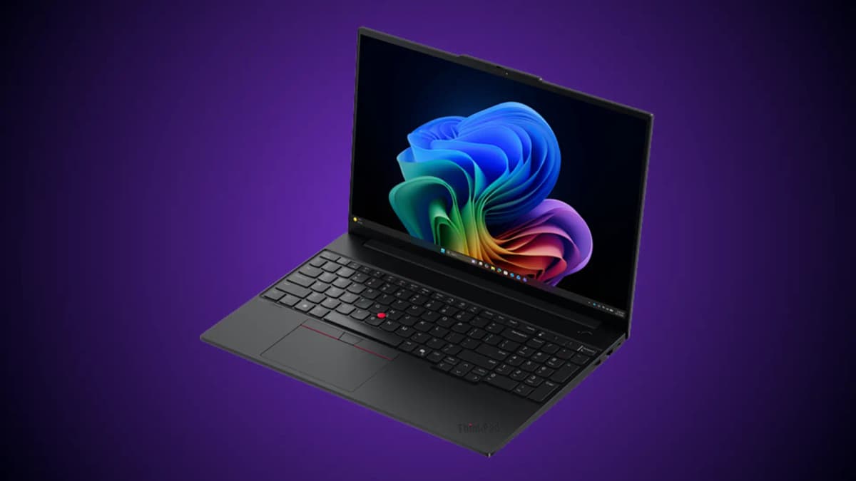 Lenovo ThinkPad E16 Gen 4 AMD laptop open on a desk, showing its 16-inch display, full-size keyboard, numeric keypad, and red TrackPoint.