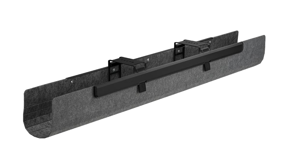 UPLIFT FlexMount Cable Manager mounted beneath a desk.