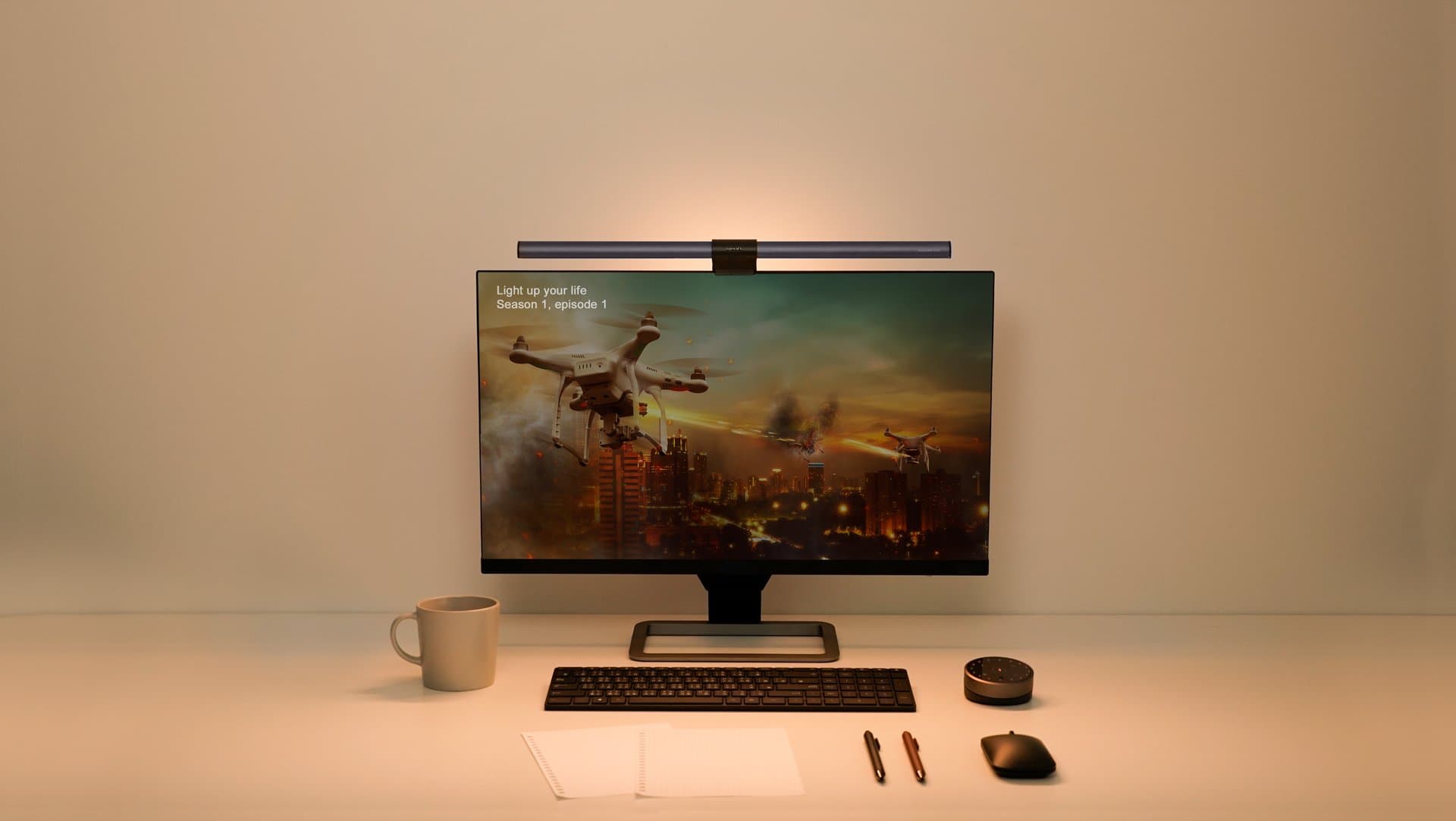 BenQ ScreenBar Halo on a monitor with its wireless controller in an official product image.