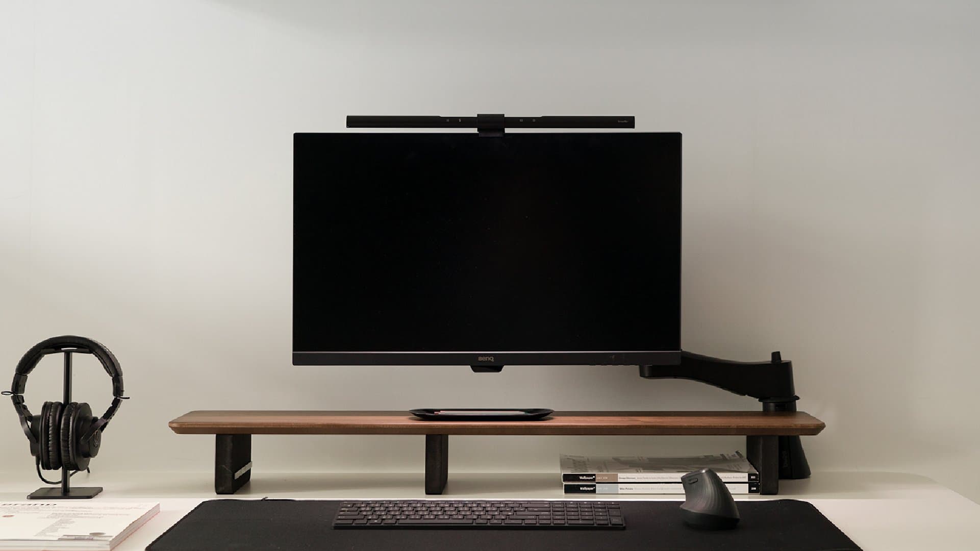BenQ ScreenBar mounted above a monitor in an official desk setup image.
