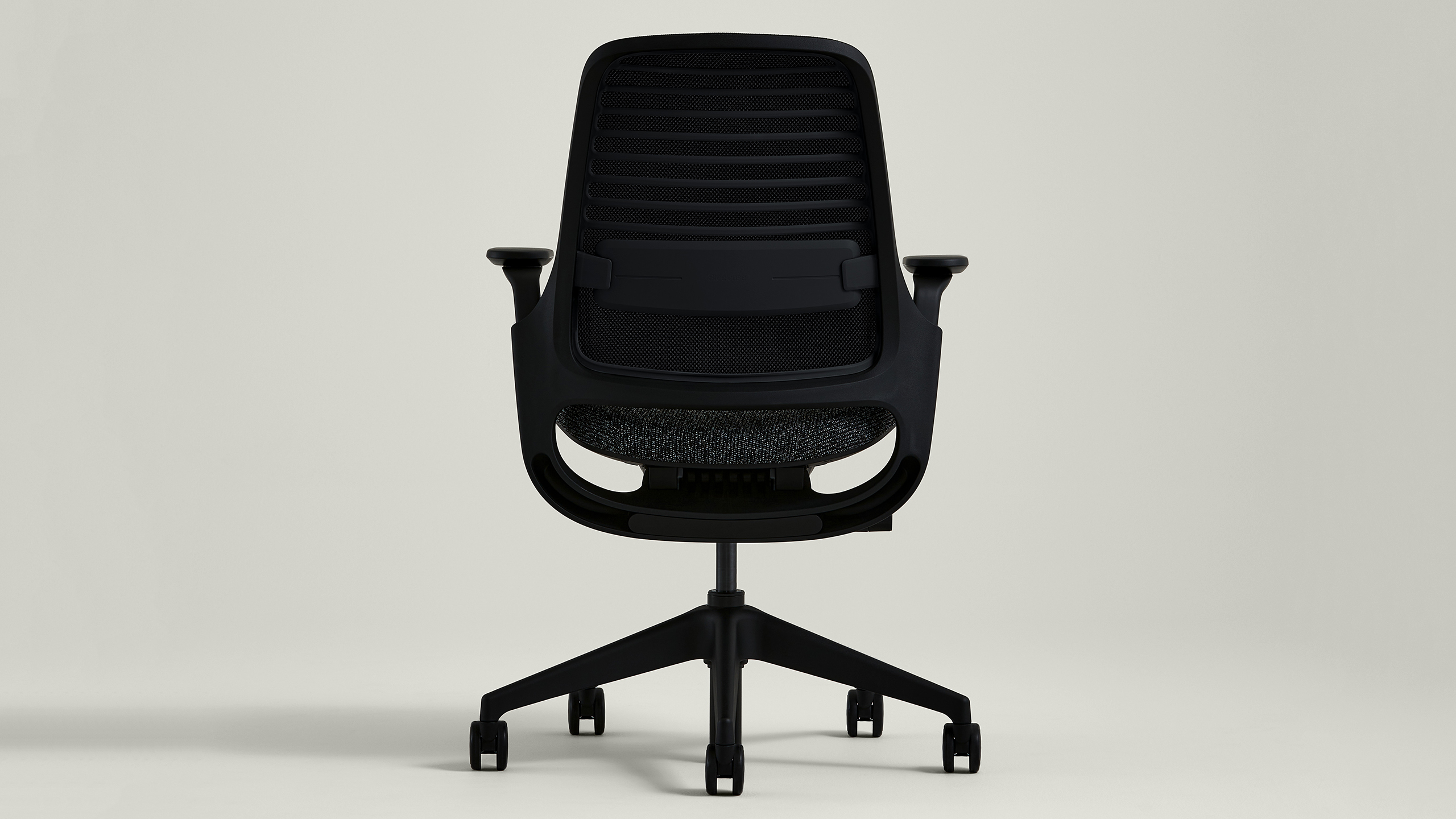 Steelcase Series 1 shown from the rear in a minimal official studio image.
